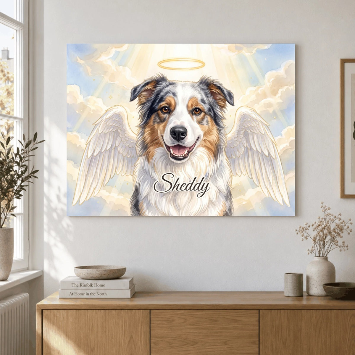 Angel memorial portrait as a landscape poster on the wall: Sheddy the dog with angel wings and a halo, with name